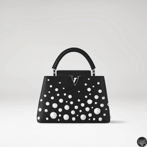 Louis_Vuitton_x_Yayoi_KusamaCapucines_MM_in_black_taurillon_leather_with_3D_silver-toned_metal_half_spheres.webp
